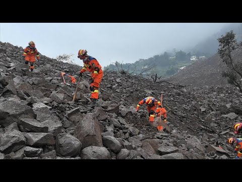 GLOBALink | Rescuers race against time for survivors after landslide in SW China