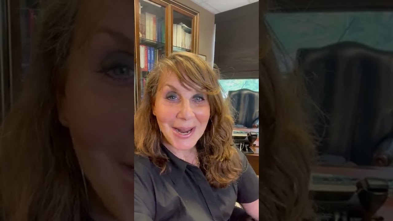 Woman speaking in an office setting.