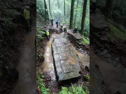 Heavy Rain Reveals Stone Platform Hidden Beneath Soil