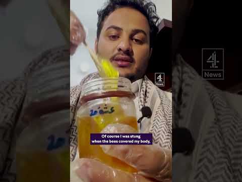 Why is this man wearing hundreds of bees?