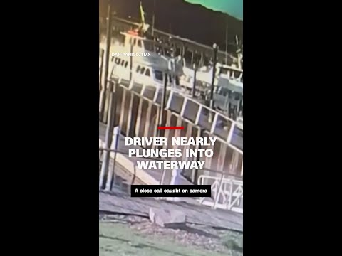 Driver nearly plunges into waterway
