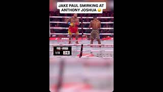 Jake Paul smirking at Anthony Joshua