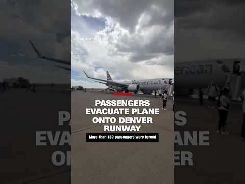 Video shows passengers evacuating plane onto runway