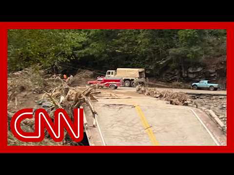 Couple and dog rescued after being trapped by floodwater for 4 days