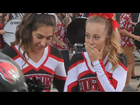 Football players&#39; kind gesture to cheerleader goes viral