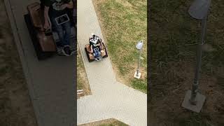 a man in a small "tank machine" on the street in the Czech Republic |muž v “tanku” na sídlišti v ČR|