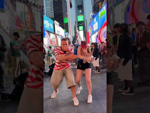The Crooked Neck Girl and the Red Carpet Guy dancing in Times Square