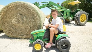 Hudson Uses Real Tractors and Kids Tractors to Make Hay