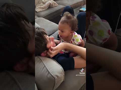 Baby sister is super cute as she tries to give big brother a kiss. ❤️#siblings