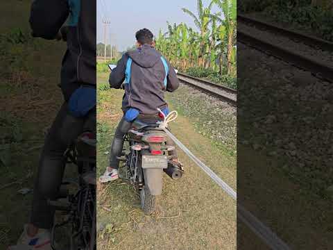 Tying a rope to the back of a motorcycle