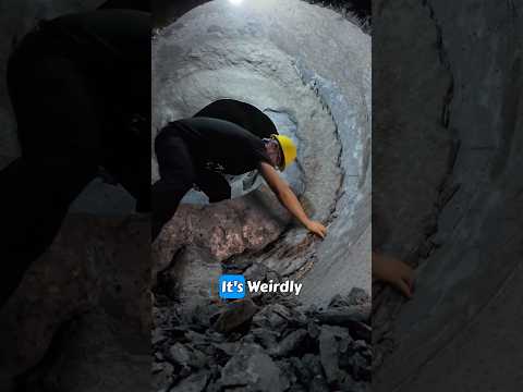 Cleaning out a concrete mixer drum.