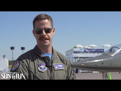 Jet Trainer Major Walsh of the USAF with airplanes in background