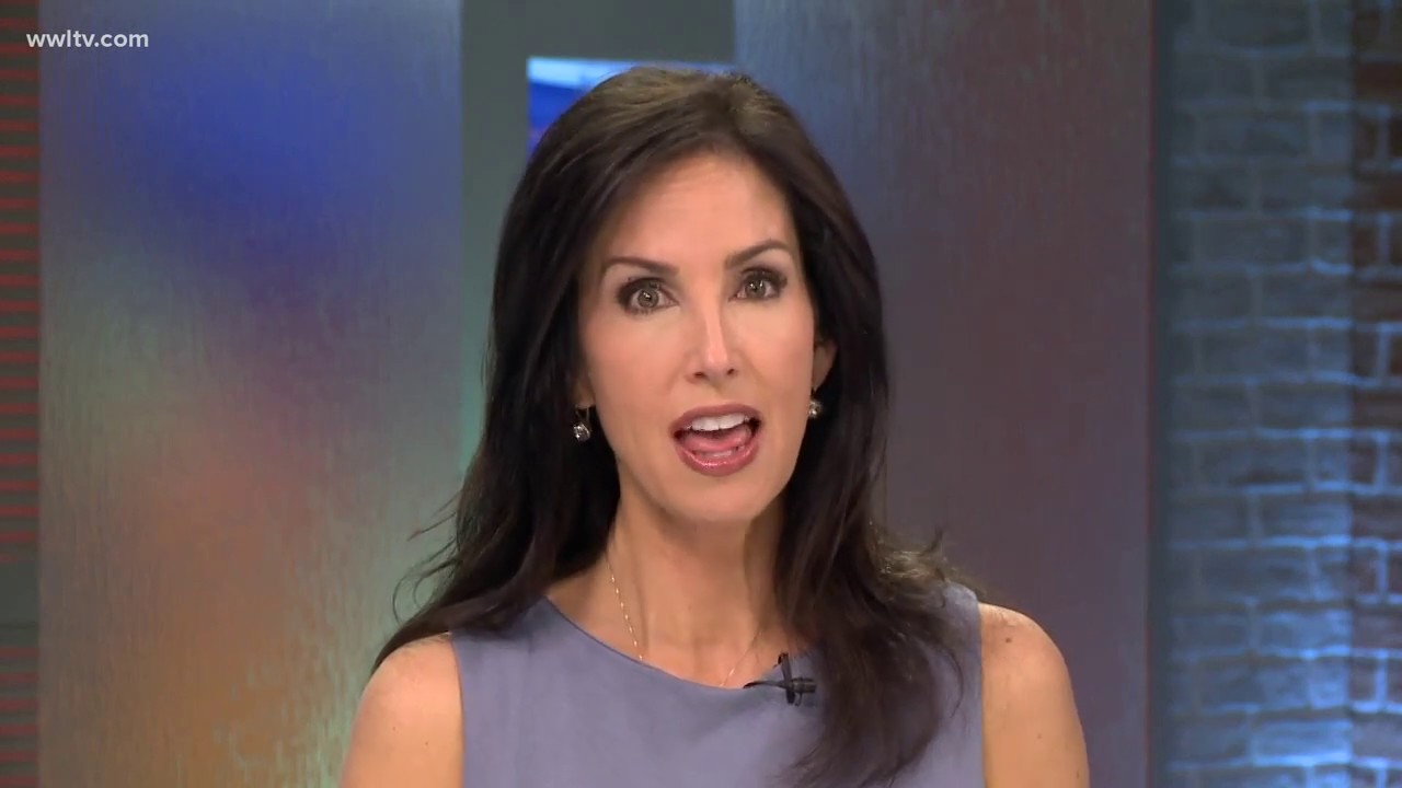 News anchor delivering a report on camera.