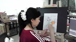 Coloring picture of a rabbit holding a carrot