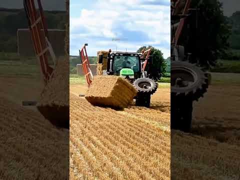 John Deere tractor and Big BaleTranstacker chasing Heston bales on a controlled traffic #johndeere