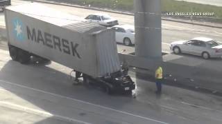 Semi truck and passengercar collision north 110 freeway near Gaffey