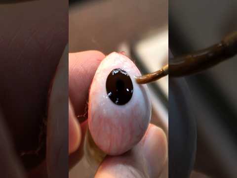 The process of making and wearing artificial eyes that are more realistic than real eyes.