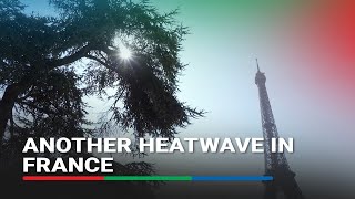 Hot weather 'better than rain' tourist in Paris says as France braces for heatwave | ABS-CBN News