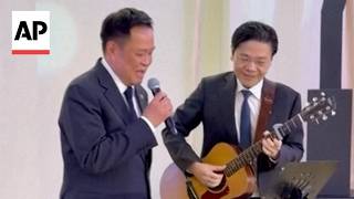 YouTube video thumbnail: Thailand and Singapore Prime Ministers Perform The Beatles' 'Let It Be' in Bangkok