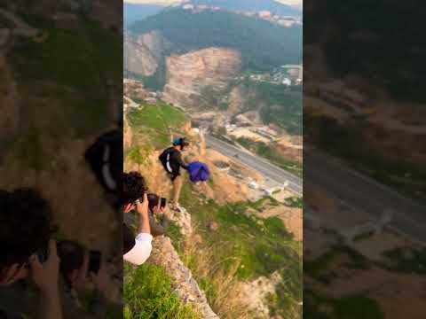 BASE jump next to paparazzis.