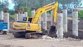 Komatsu PC 200 Excavator is Working to Build a Bridge