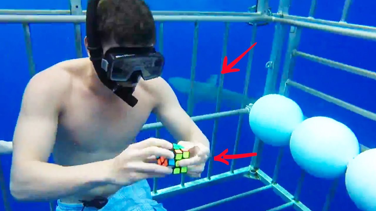 Clock Vs. Sharks: Man Solves Rubik’s Cube Underwater & More | GOALS