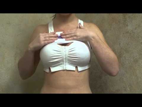 Woman demonstrating bra fitting technique.