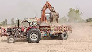 Tractor Pulling and loading sand on Trollley with Excavator Machine