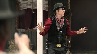 Thugs bully a frail-looking photographer, unaware he is a legendary gunslinger