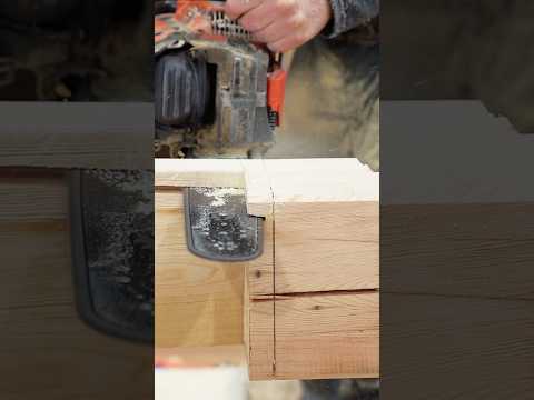 Chainsaw on timber frame notch