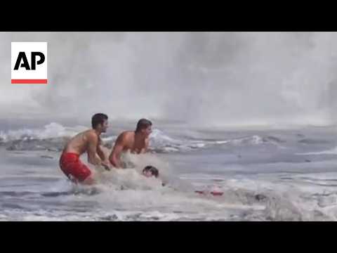 Father of child rescued from California waves says lifeguard risked 'his own safety'