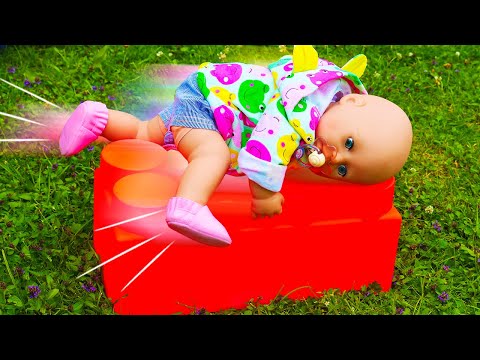 Baby Annabell doll plays on a playground for kids. Baby dolls videos for kids. New swings and toys.