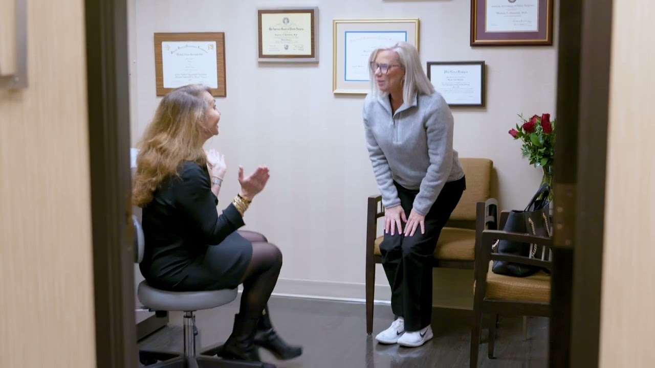 Two women in a consultation room discussing.