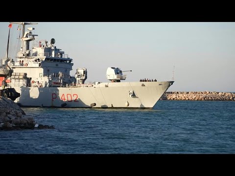 Italian navy brings first migrants to Albania centre | AFP