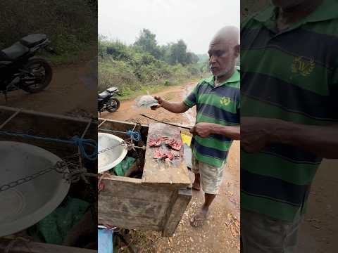 Village Fisherman Cutting Thilapia Fish