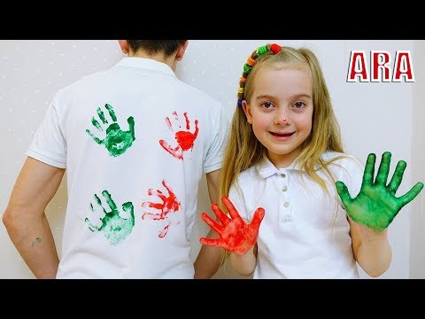 يتمتع Ulya و Dad بلوحة ممتعة مع طلاء ملون على قميص