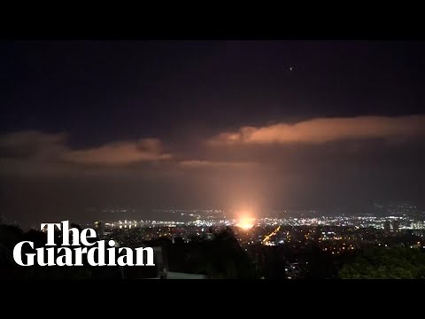 Moment apparent projectile hits Haifa in Israel on third night of conflict with Iran