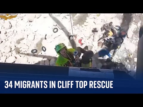 Italy: Authorities rescue migrants from cliff in Lampedusa