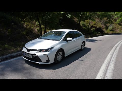 TOYOTA COROLLA 1.5 SEDAN driving in the forest