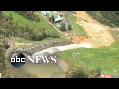 Thousands in Puerto Rico rush for higher ground as large dam begins to fail