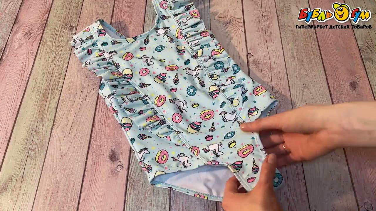Купальник Lanson Kids слитный с рюшами принтом единорогов и пирожных бирюзовый - видео Купальник Lanson Kids слитный с рюшами принтом единорогов и пирожных бирюзовый - видео
