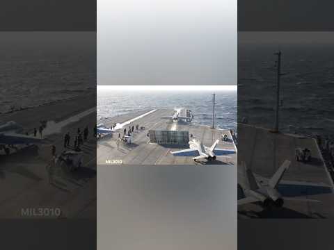 U.S. Navy F/A-18 fighter jets take off from the aircraft carrier USS George H.W. Bush (CVN 77)