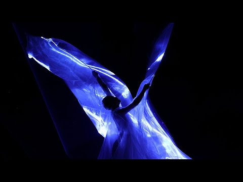 YouTube video thumbnail: Iris Van Herpen Unveils Extraordinary Bioluminescent Algae Dress at Paris Couture Week