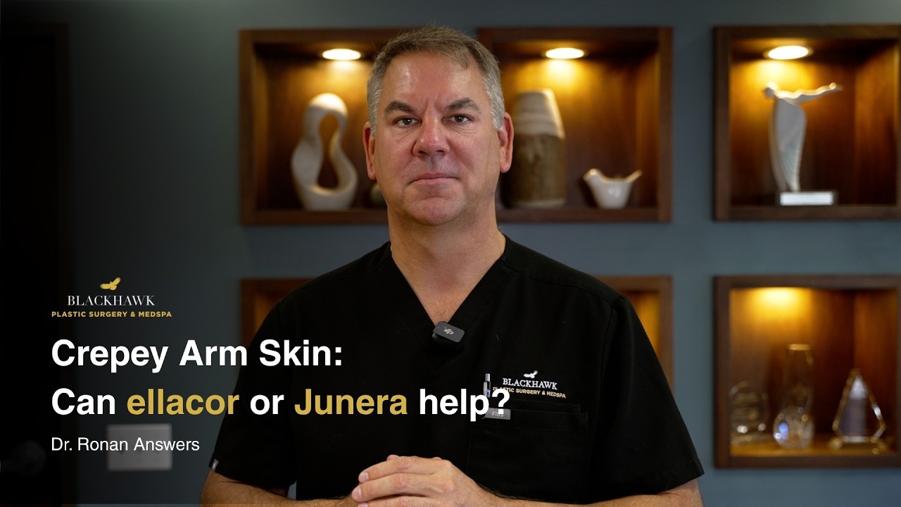 Doctor discussing treatments for crepey arm skin.