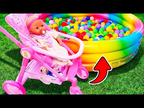 Feeding Baby Annabell doll in a toy feeding chair. A new stroller for the baby doll. Family videos.