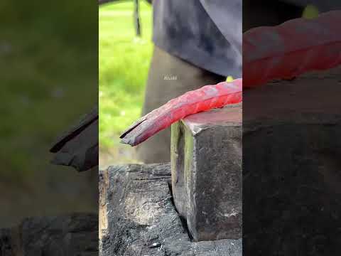 Watch this blacksmith bend hot steel and shape it into a strong diggingcrowbar amazing skill#shorts