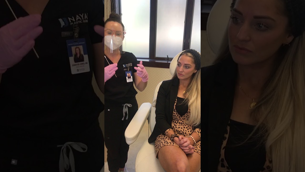 Consultation in a medical aesthetic setting.