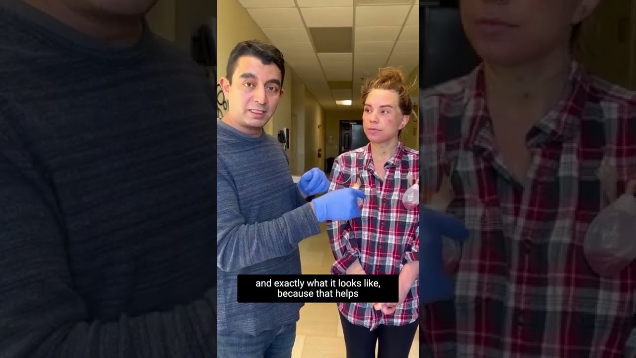 Medical demonstration with two people in conversation.