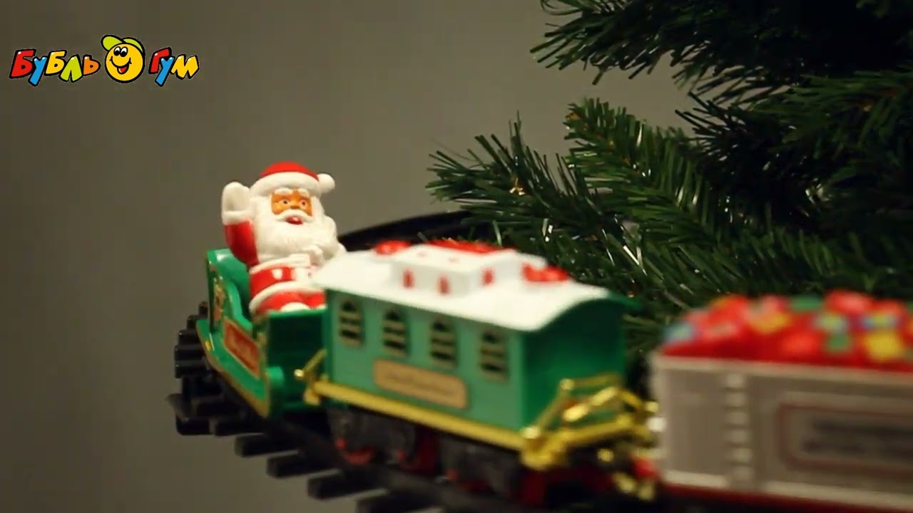 Железная дорога Новогодний поезд вокруг елки на батарейках  - видео Железная дорога Новогодний поезд вокруг елки на батарейках  - видео
