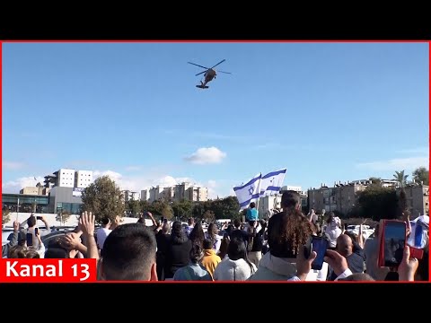 Crowd celebrates as helicopter brings four released hostages to hospital in Israel